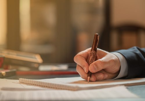 Director signing documents with a fashion pen. High quality photo